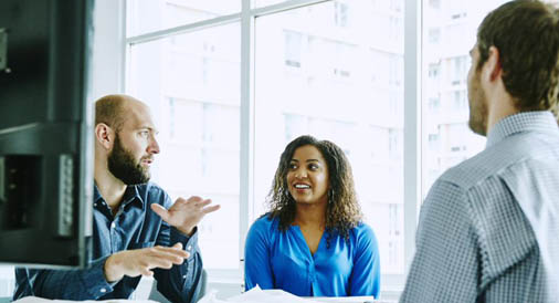 Employees discussing work